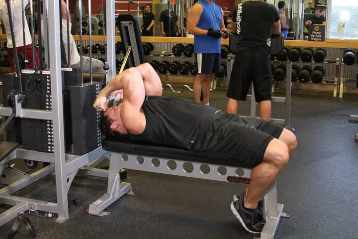 High Cable Curls — End position