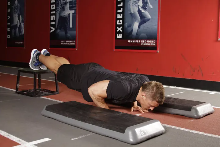 Incline Push-Up Depth Jump — Start position