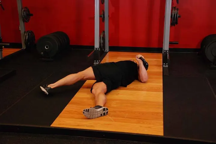 Leg-Over Floor Press — Start position