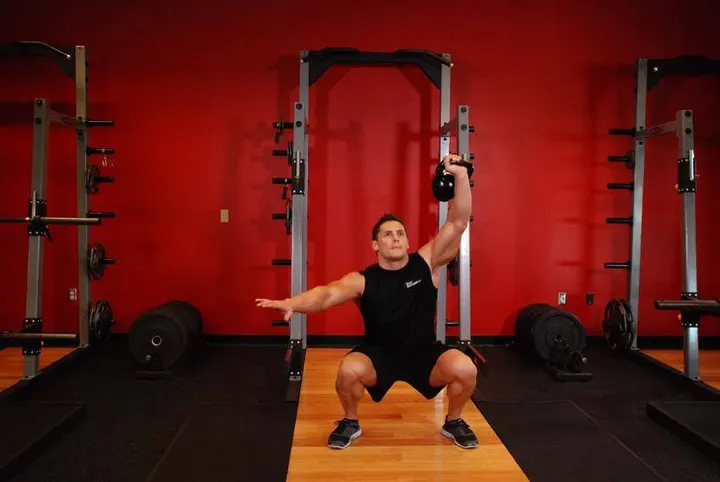 One-Arm Overhead Kettlebell Squats — End position