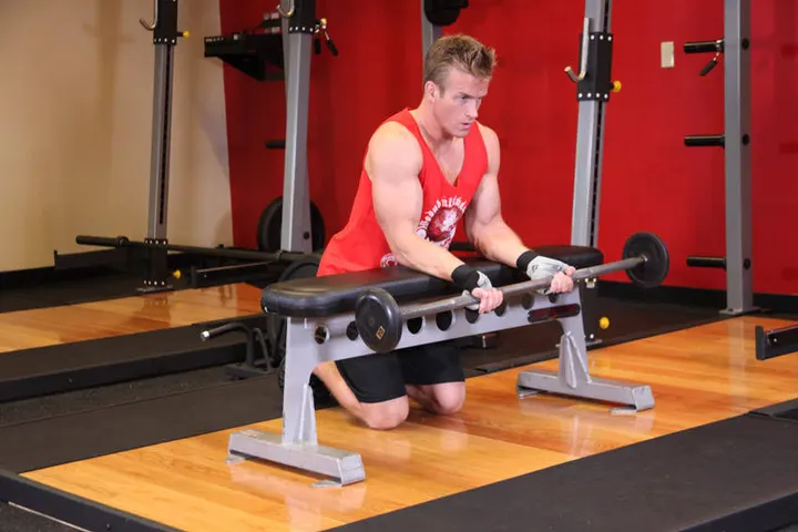 Palms-Up Barbell Wrist Curl Over A Bench — Start position