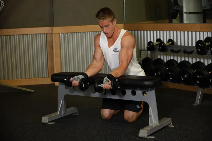 Palms-Up Dumbbell Wrist Curl Over A Bench — Start position