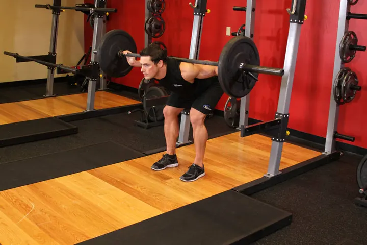 Stiff Leg Barbell Good Morning — End position