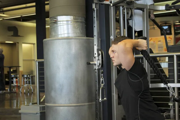 Triceps Overhead Extension with Rope — Start position